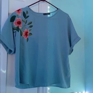 Blue. Floral print blouse. New